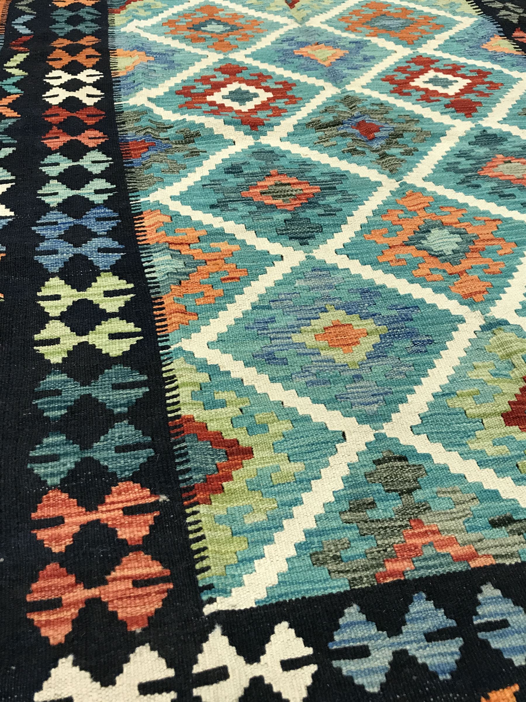 Choli Kilim blue ground rug, geometric patterned repeating border - Image 2 of 3