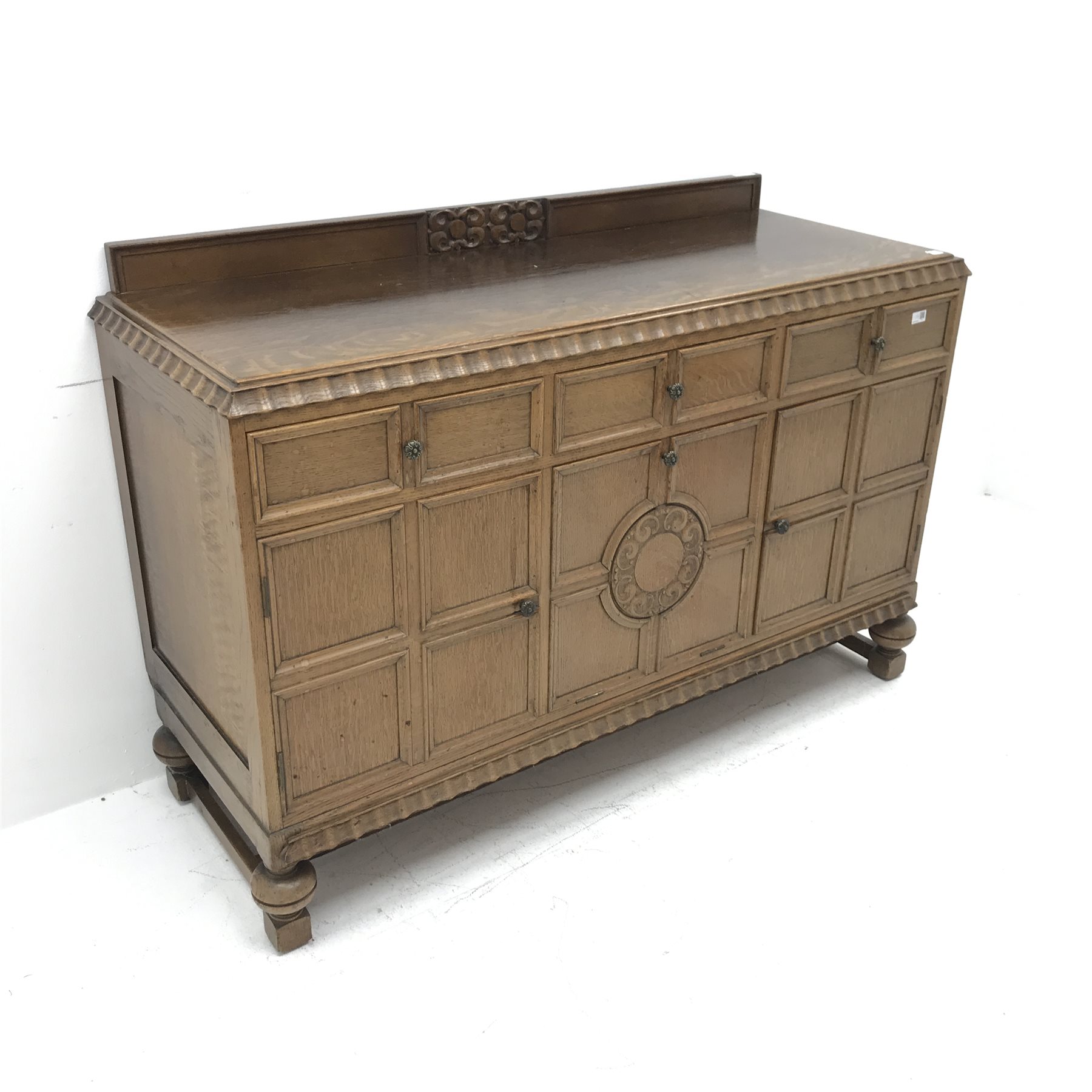 E. Gomme Ltd of High Wycombe oak sideboard, raised carved back, moulded top, three drawers above two - Image 3 of 5