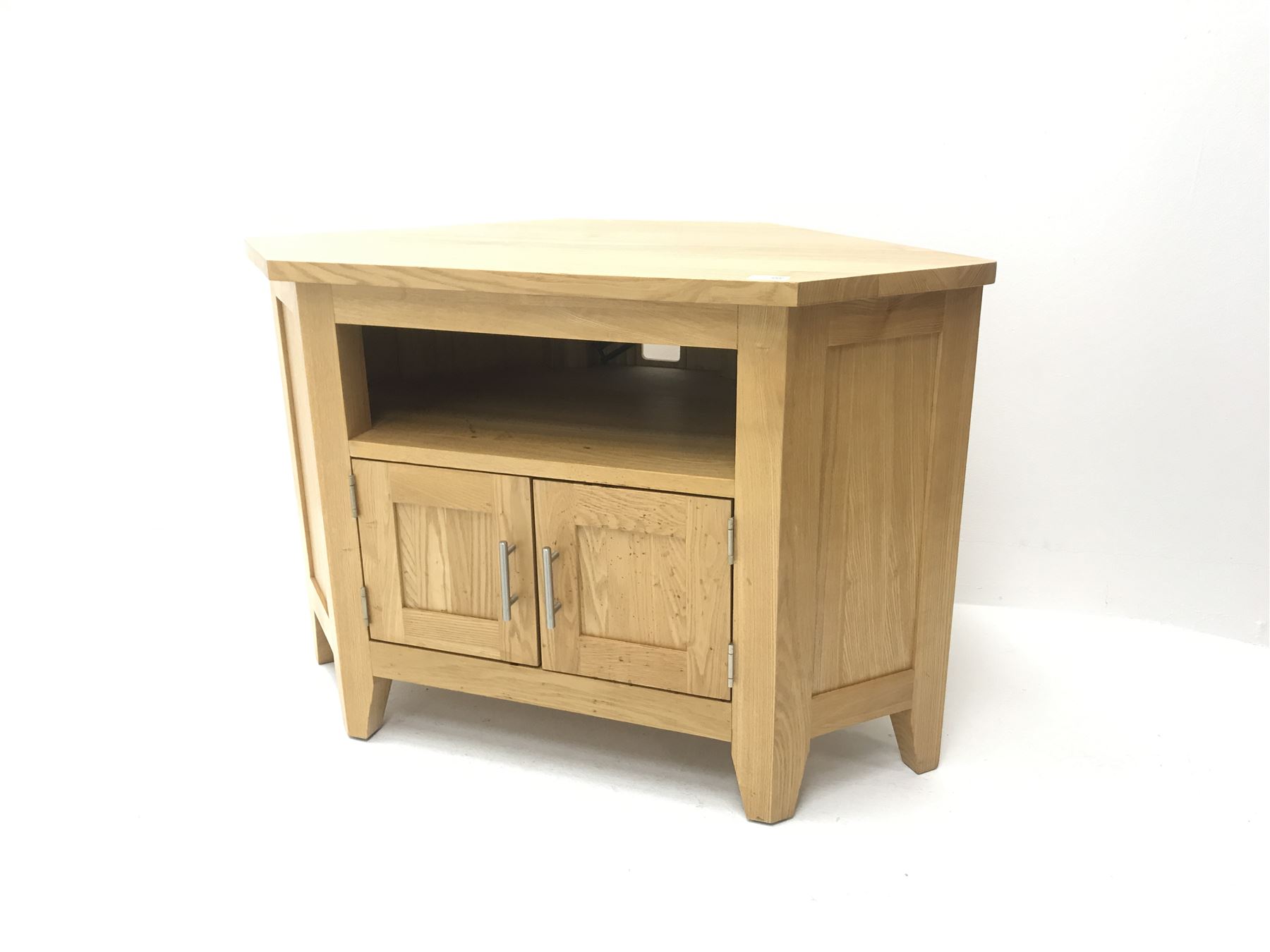 Light oak corner television stand, single shelf above two cupboard doors, stile supports