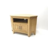 Light oak corner television stand, single shelf above two cupboard doors, stile supports