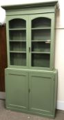 19th century and later painted pine cupboard, projecting cornice, two glazed doors enclosing three s