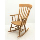 Farmhouse style beech rocking chair, turned supports joined by double H stretcher, W67cm