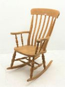 Farmhouse style beech rocking chair, turned supports joined by double H stretcher, W67cm