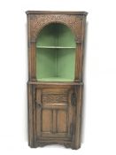 Jacobean style carved oak corner cabinet, open painted shelves above single cupboard, W75cm, H178cm