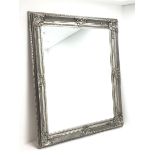 Large rectangular mirror in ornate silvered frame decorated with acanthus scroll shell cartouches an