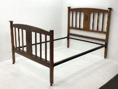 Early 20th century oak 4' 6'' double bedstead, arched cresting rail above central carved panel and s