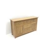 Light oak sideboard, five drawers and two cupboards, stile supports