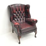Queen Anne style Chesterfield wing backed armchair, upholstered in deep buttoned Ox blood leather, c