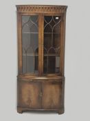 Reproduction Bevan Funnell mahogany double corner cabinet, projecting dentil cornice, two doors encl