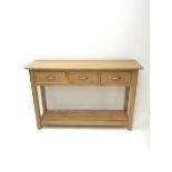 Light oak side console table, three drawers, square supports joined by solid undertier