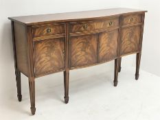 20th century mahogany sideboard, shaped banded top over three drawers, double cupboard and two singl