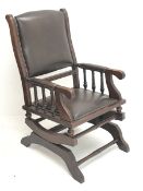 19th century mahogany framed American rocking armchair, seat, back and arms upholstered in brown stu