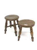 Two 19th century elm milking stools, circular seats on turned supports
