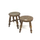 Two 19th century elm milking stools, circular seats on turned supports