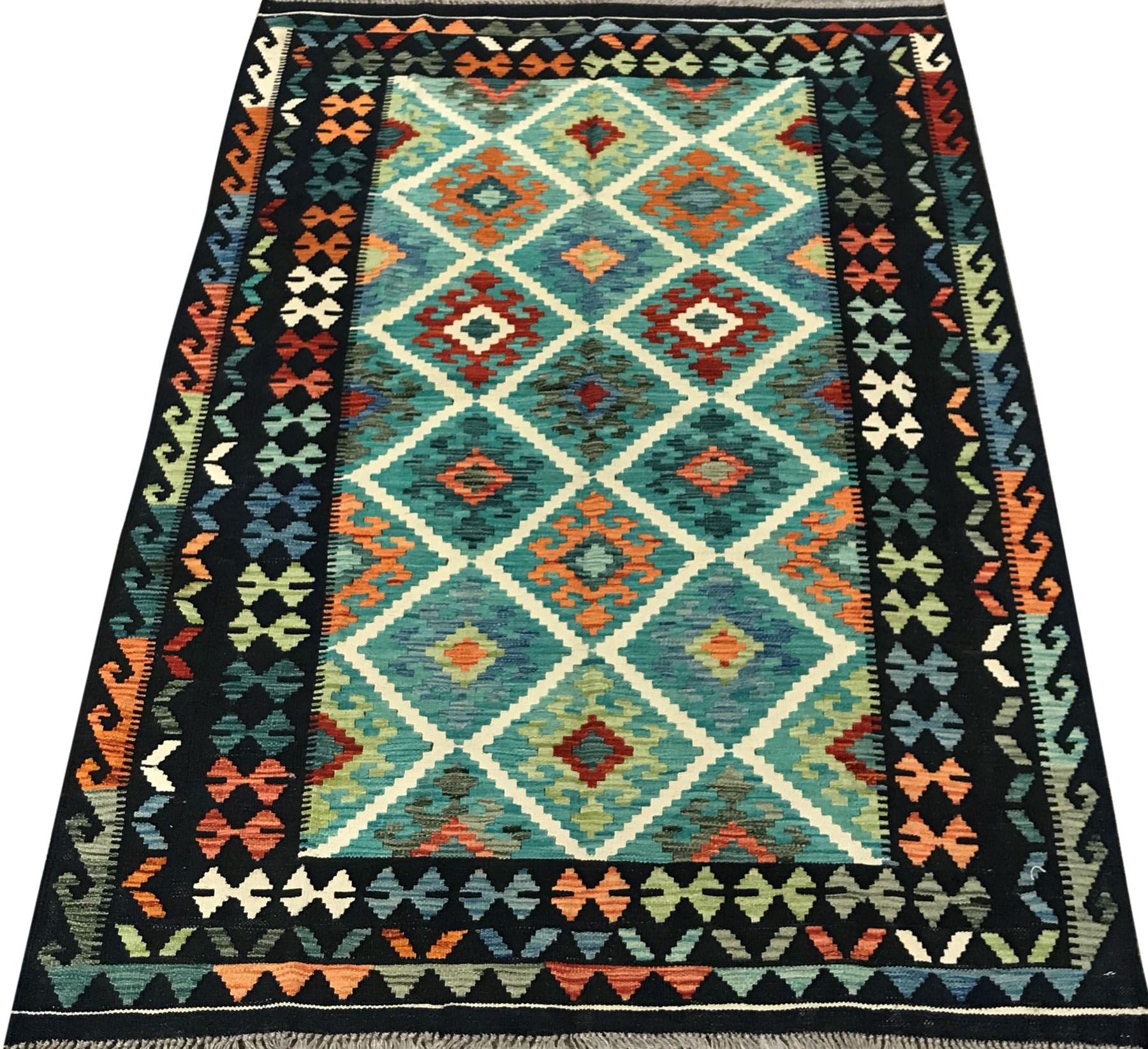 Choli Kilim blue ground rug, geometric patterned repeating border