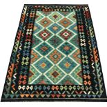 Choli Kilim blue ground rug, geometric patterned repeating border