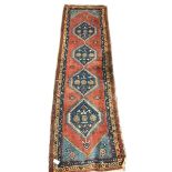 Turkish runner rug, red ground with quadruple pole medallion, three band border decorated with flowe