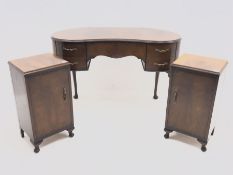 Early 20th century walnut kidney shaped dressing table (W120cm, H78cn, D60cm), and pair of bedside c