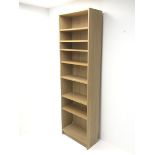 Light oak open bookcase, seven shelves, plinth base