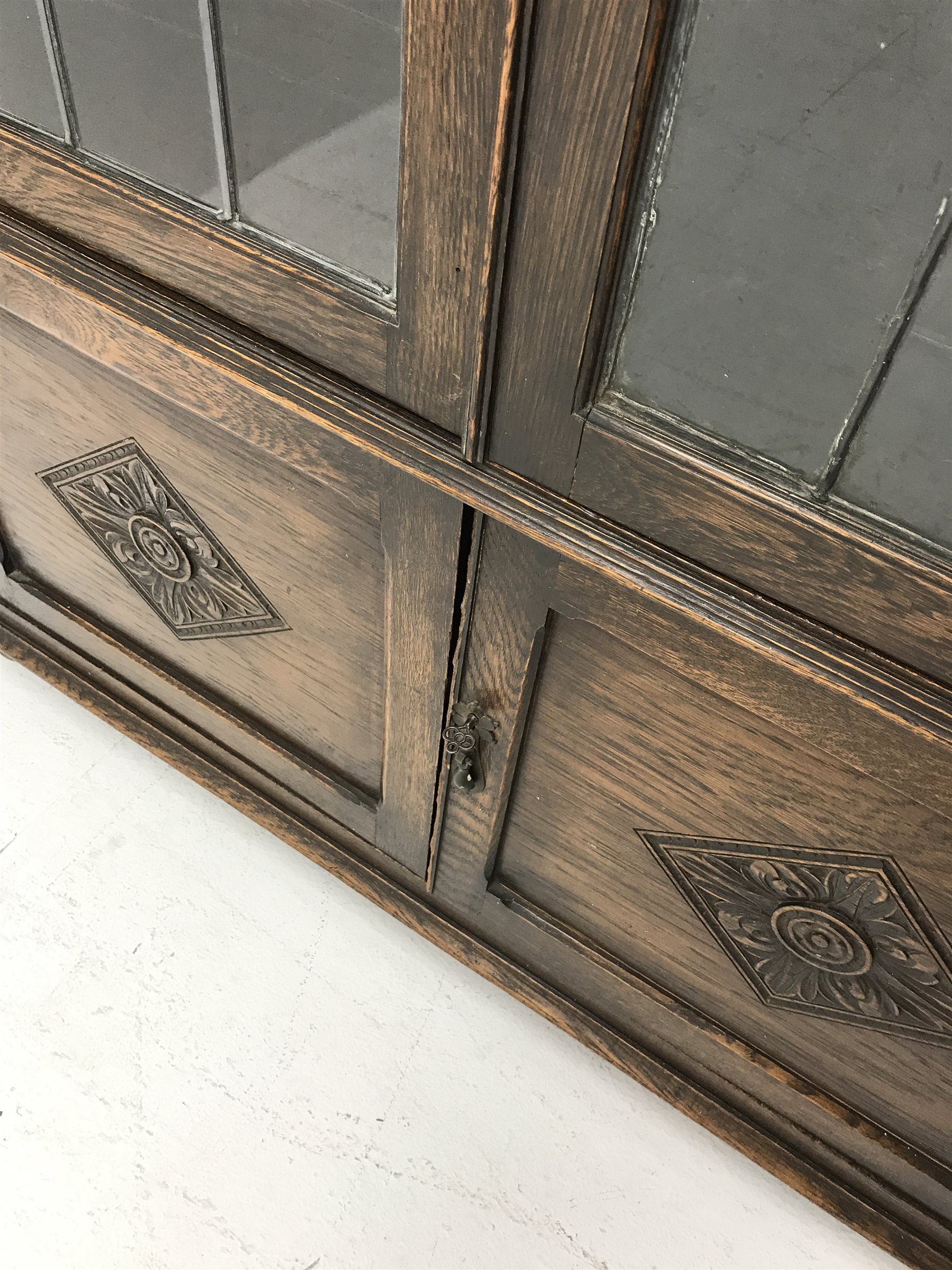 Early 20th century oak bookcase, two lead glazed doors enclosing four shelves above two cupboards, t - Image 3 of 3