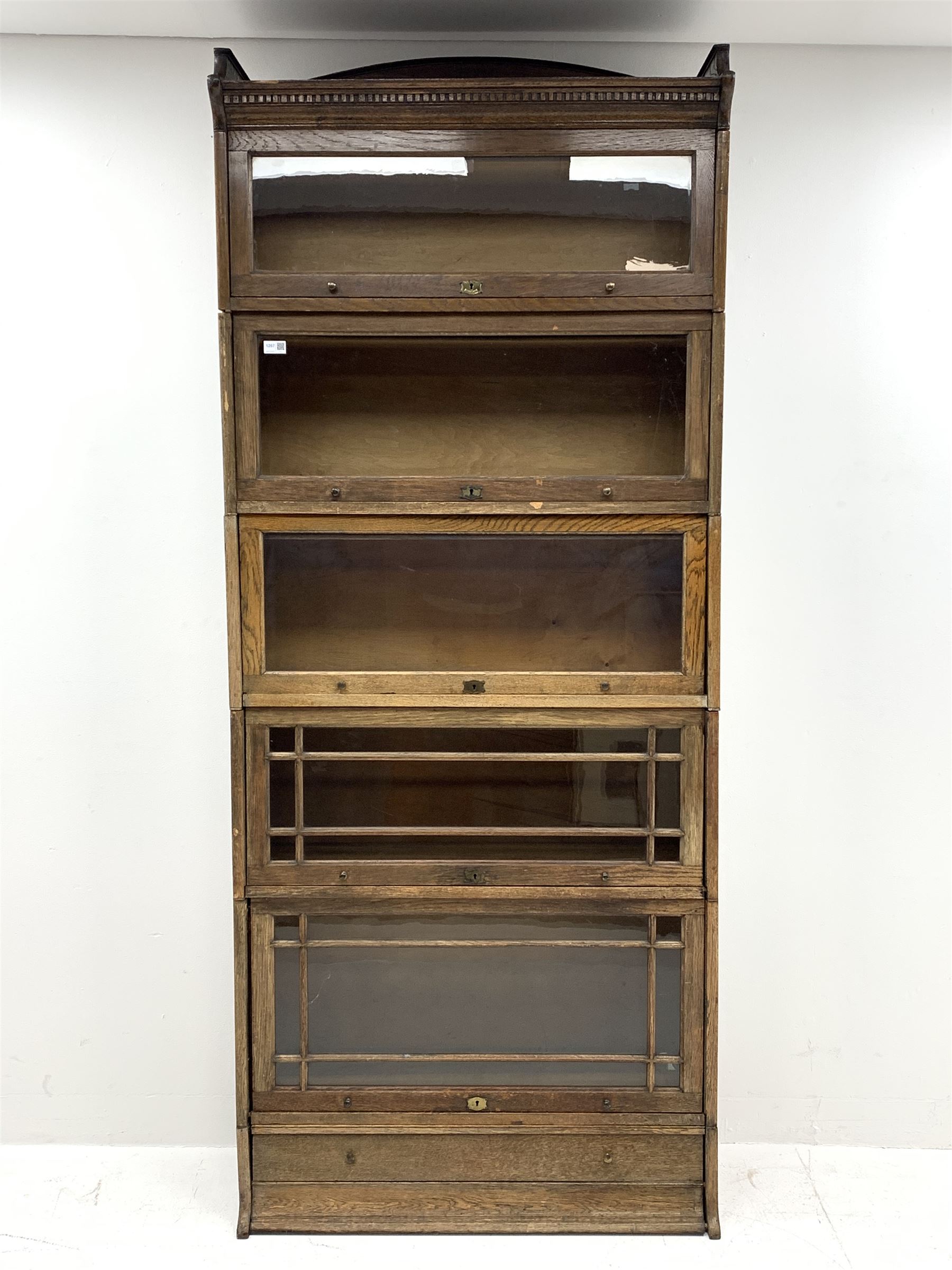 Early 20th century oak stacking library bookcase, five graduating sections with hinged and sliding g