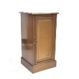 Late Victorian walnut bedside cabinet, moulded top over single panelled door with moulded frame, on