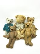 Four 1950s English teddy bears including wood wool filled Chiltern bear with swivel jointed head