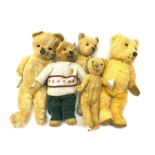 Five English teddy bears c1930s-50s including wood wool filled Chiltern with revolving head, glass e