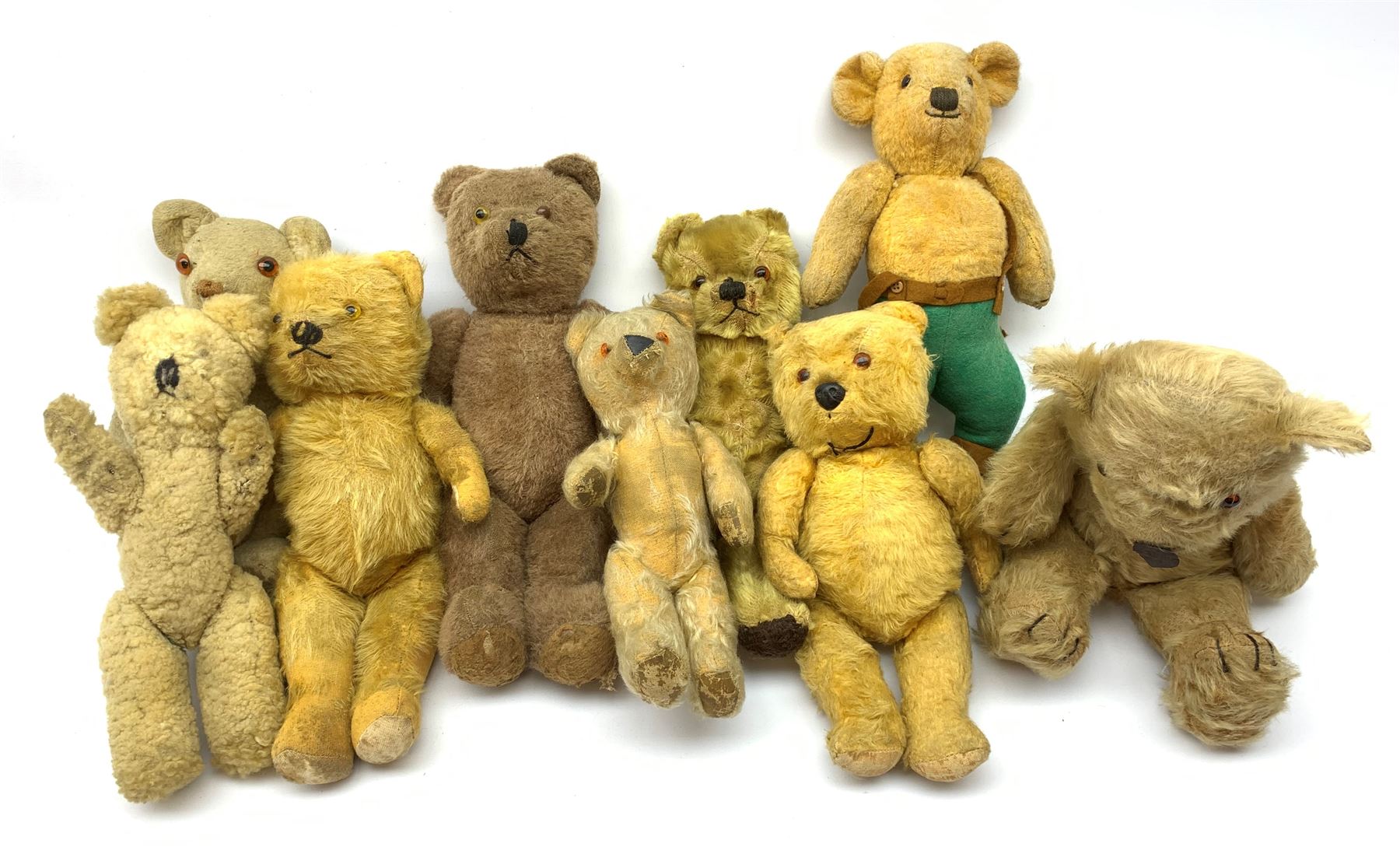 Nine English teddy bears 1950s-60s including wood wool filled Pedigree bear with swivel jointed head