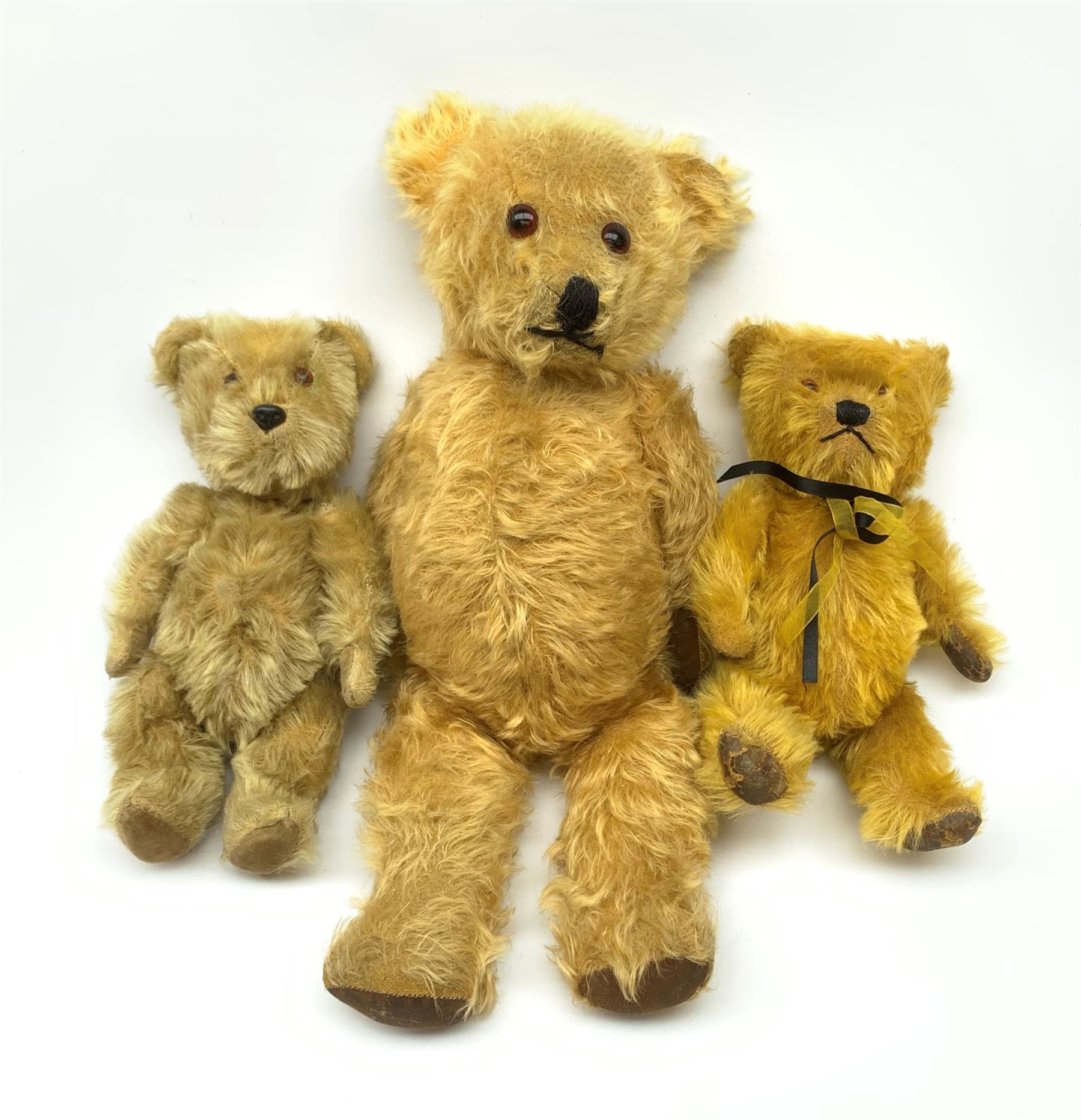 Three English teddy bears c1930s-50s comprising Chiltern wood wool filled Hug-Mee flat faced bear wi