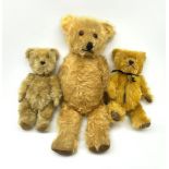 Three English teddy bears c1930s-50s comprising Chiltern wood wool filled Hug-Mee flat faced bear wi