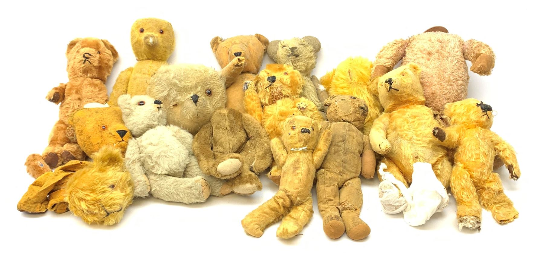 Quantity of early wood wool filled teddy bears for restoration.