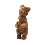 'Meabeab' Russian clockwork plush covered bear c1950s depicted standing with open mouth holding an i