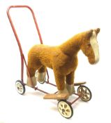 Pedigree push along plush covered horse 1950s-60s with red tubular metal framework and beech foot re