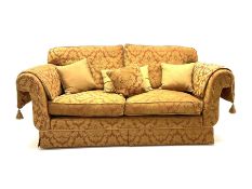 Grande two seat sofa upholstered in red and gold damask fabric with complimentary cushions