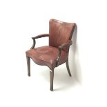 Early 20th century mahogany framed elbow chair upholstered in studded red leather with serpentine se