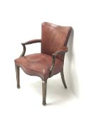 Early 20th century mahogany framed elbow chair upholstered in studded red leather with serpentine se