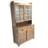 Vintage oak dresser raised back with two glazed doors enclosing shelves above two sliding base drawe