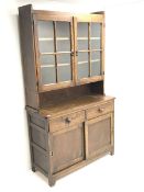 Vintage oak dresser raised back with two glazed doors enclosing shelves above two sliding base drawe