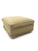 Square footstool upholstered in pale patterned fabric