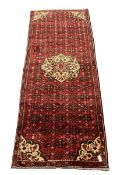 Persian red ground runner rug