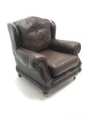 Thomas Lloyd wing back armchair upholstered in a brown leather
