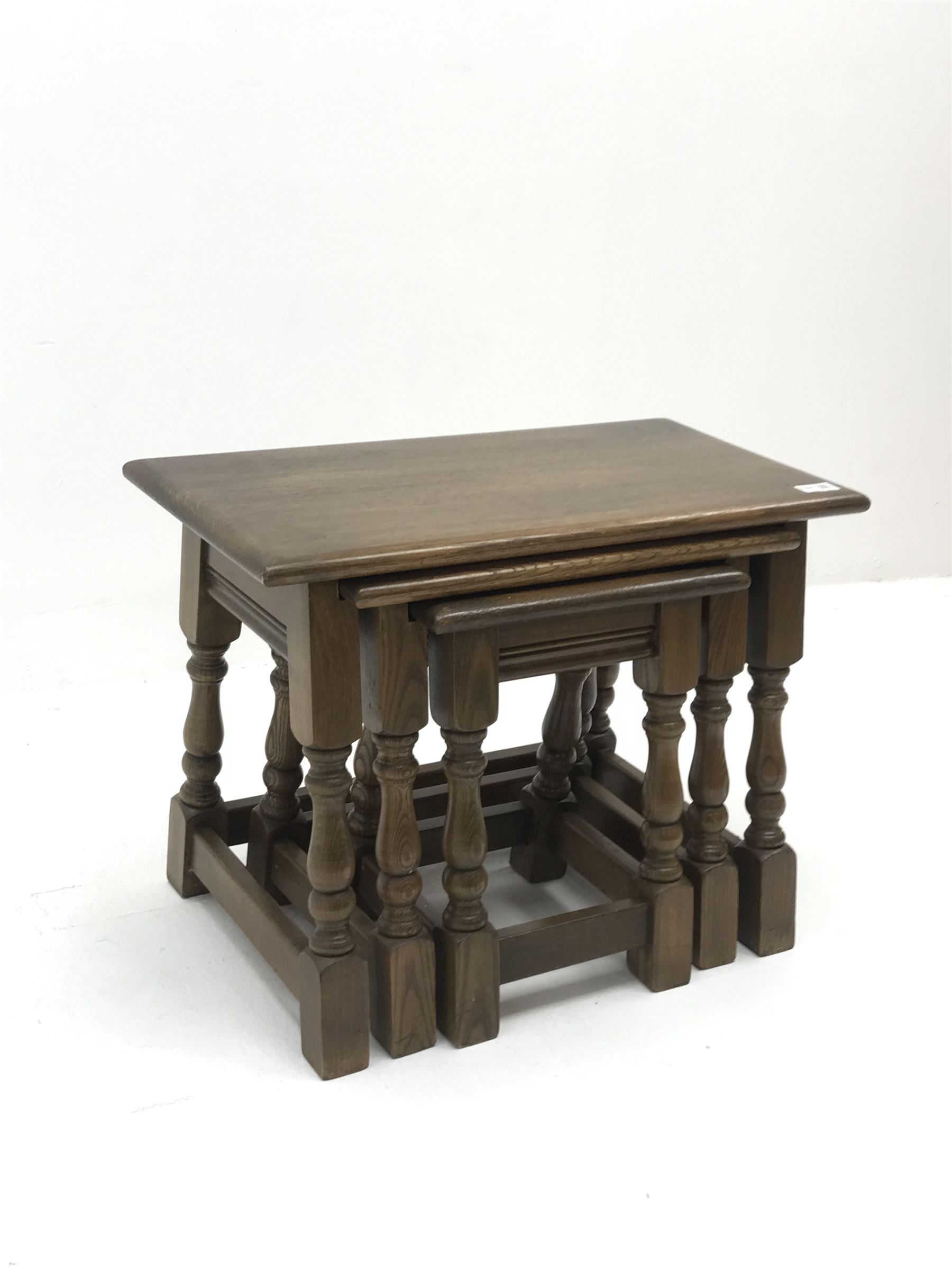 Medium oak nest of three Joint style tables