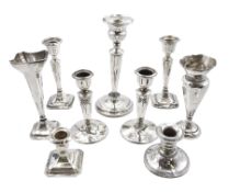 Two pairs of silver candlesticks