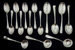 Set of four silver dessert spoons