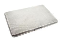 Silver cigarette case with engine turned decoration by Payton