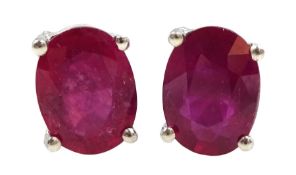 Pair of silver oval ruby stud earrings