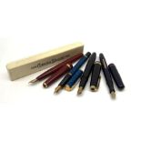 A group of four fountain pens