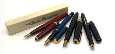 A group of four fountain pens