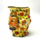 An early 19th century Staffordshire canary yellow Satyr mask jug